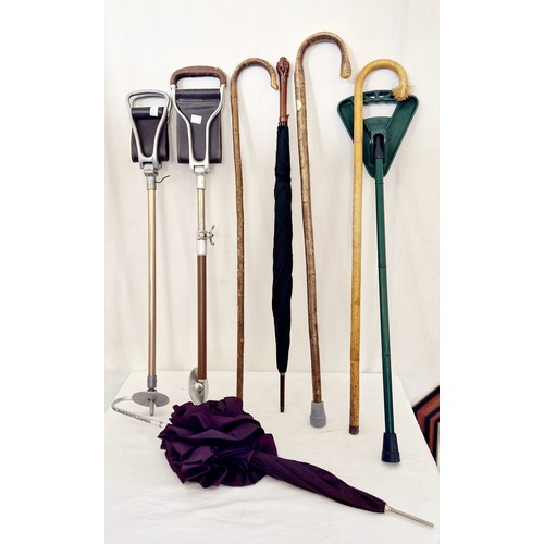 115 - Various walking sticks, shooting sticks and parasols