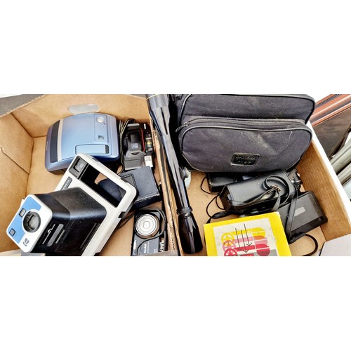 133 - Two boxes of various 35mm and Poleroid cameras etc