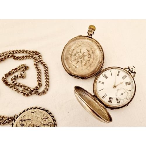 203 - Two silver cased pocket watches for restoration and metal medallion on chain