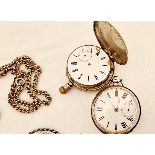 203 - Two silver cased pocket watches for restoration and metal medallion on chain