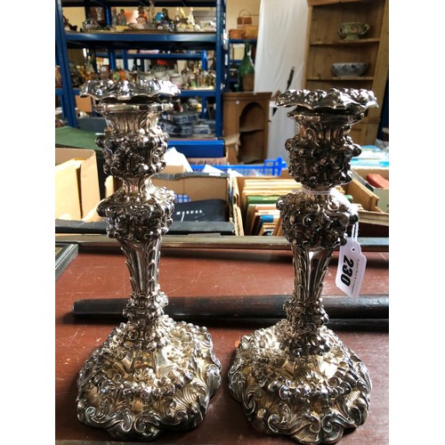 230 - A pair of London 1811 silver candlesticks, with profuse embossed foliate decoration and a pair of Bi... 