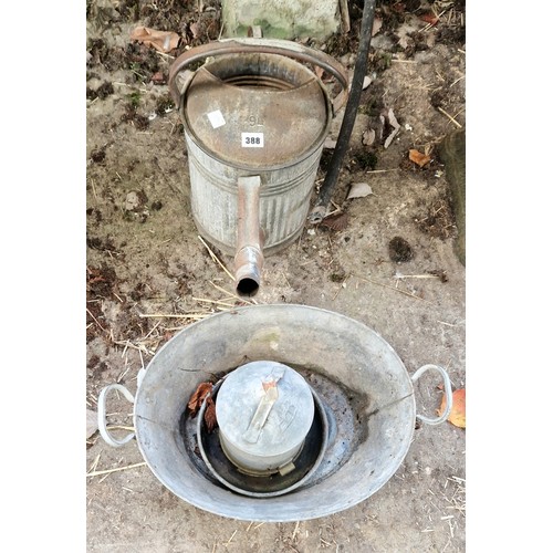 388 - Galvanised watering can, small bath and poultry drinker