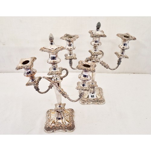 92 - A pair of ornate EPNS 3 branch candelabras