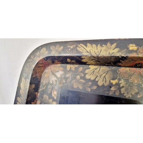 115 - Black lacquered papier-mâché tray with floral boarder (some damage) approx. 77cm x 59cm