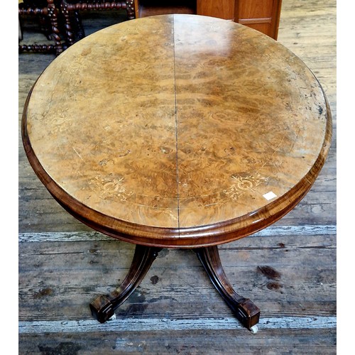 278 - Victorian walnut oval tilt-top tea table with boxwood inlay, four fluted supports to an ornate base ... 