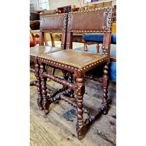 286 - Pair of oak framed upright chairs with leatherette studded seats and backs on barley twist supports