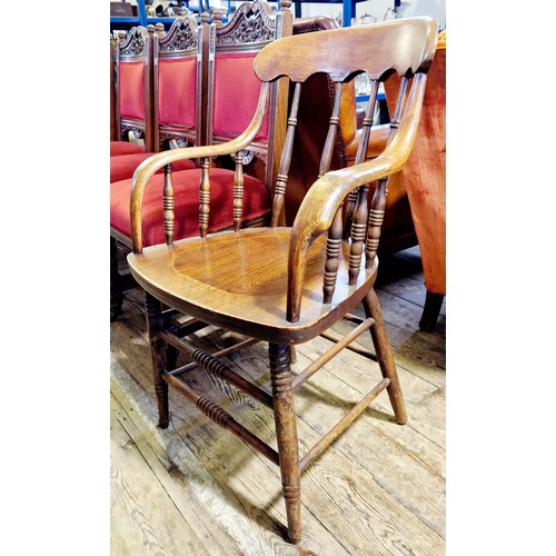 291 - A Victorian oak spindle back elbow chair with bobbin turned supports