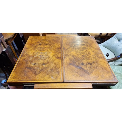 297 - Early 20th century walnut metamorphic 2-tier tea trolley which converts to a table