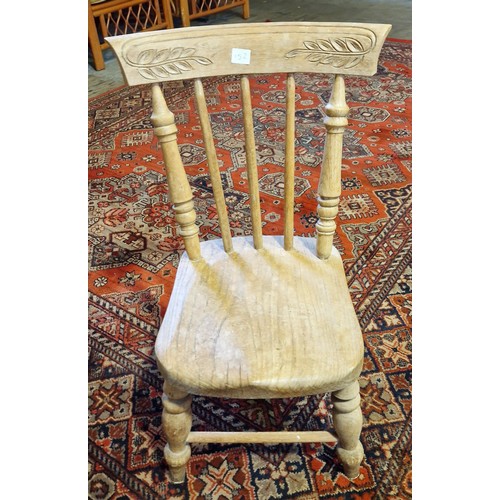 299 - A child's rustic elm spindle back chair