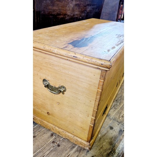 302 - Large pine chest with inner candle box and drawers and lower drawer with campaign handles