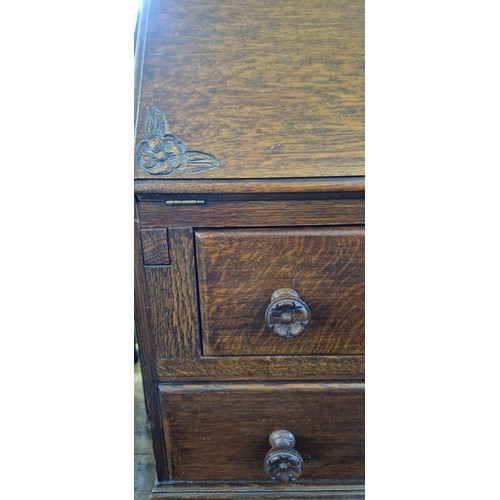 309 - A mid-century small oak bureau with fall front and floral carved corners over 2 drawers on cabriole ... 