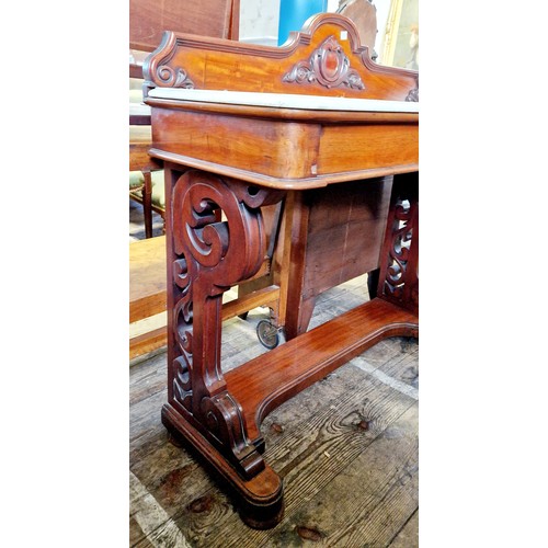 318 - A Victorian mahogany rectangular side table with marble top, 2 frieze drawers on shaped pierced supp... 