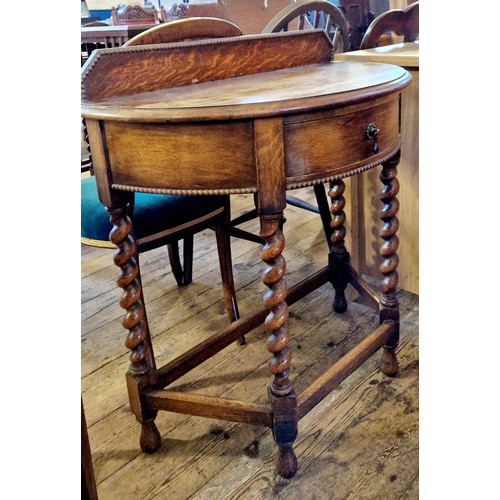 326 - An early 20th century oak demi-lune side table with single drawer on barley twist legs