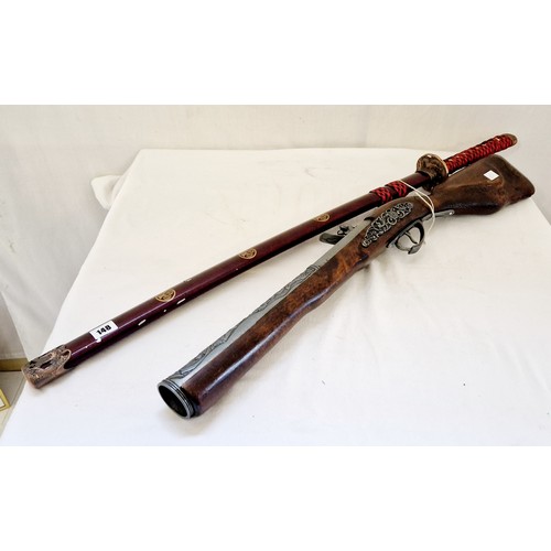 148 - An ornamental blunderbuss and Japanese officers modern ceremonial sword with stainless steel blade