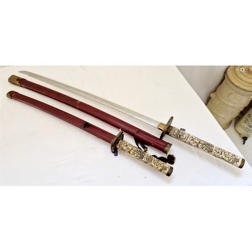 150 - Two reproduction Japanese swords, with relief carved bone handles, a wakizashi (short sword) and off... 