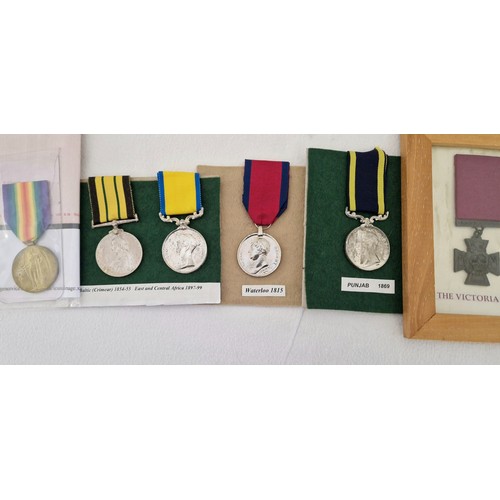 157 - A collection of replica medals including Queen's Crimea Africa Campaign; Waterloo 1815 India Campaig... 