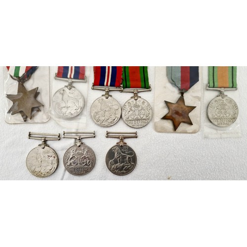 158 - A collection of nine GB WWII medals, comprising a group of two War & Defence Medals; two 1939-45 Sta... 