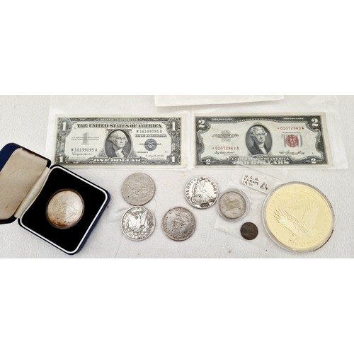 175 - USA bank notes and coinage, comprising 1 and 2 dollar bills; 1904 Trade Dollar; 1971 silver dollar; ... 