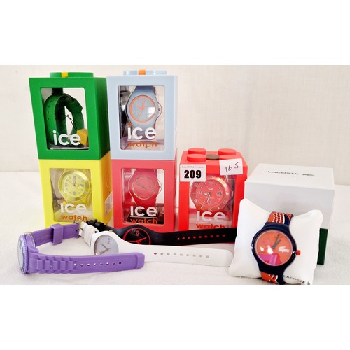 209 - 9 various boxed wristwatches; Ice and Lacoste