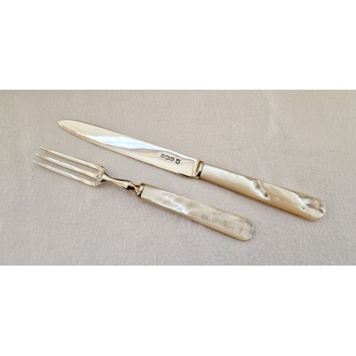 237 - An eight-service fruit cutlery set, with Sheffield 1959 silver blades and tines and mother of pearl ... 