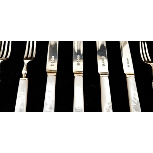 237 - An eight-service fruit cutlery set, with Sheffield 1959 silver blades and tines and mother of pearl ... 