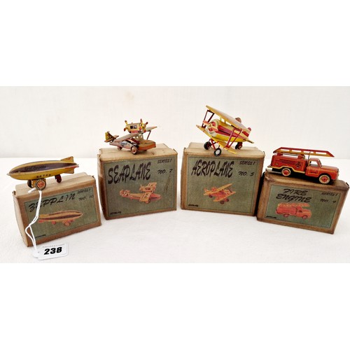 238 - A collection of four ZZ tin plate toys; Seaplane No 7; Aeroplane No 5; Fire engine No 9 and Zepplin ... 