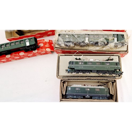 254 - A collection of boxed Hag OO gauge model railway incl. 3 engines and carriage