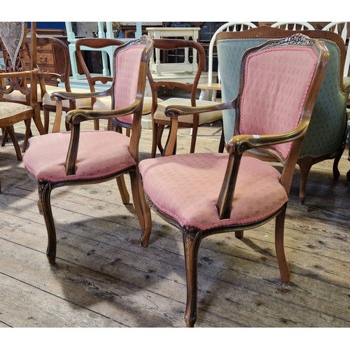 219 - Pair of reproduction mahogany framed upholstered elbow chairs on carved cabriole legs