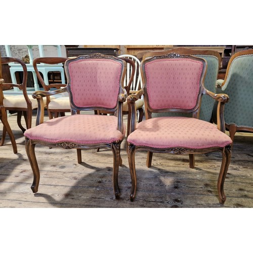 219 - Pair of reproduction mahogany framed upholstered elbow chairs on carved cabriole legs