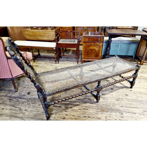 221 - Early 20th century oak ornately carved day bed with barley twist stretchers and rattan panels, some ... 