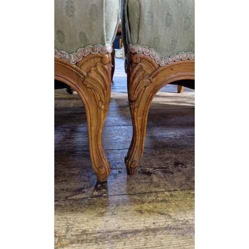 223 - Pair of reproduction walnut framed elbow chairs on carved cabriole legs