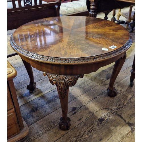 243 - Circular mahogany occasional table on carved cabriole legs to ball and claw feet