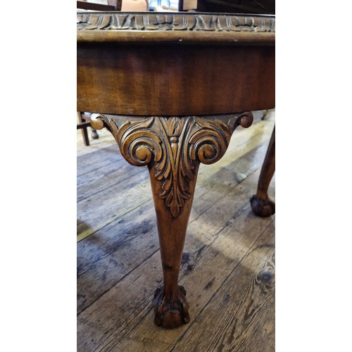 243 - Circular mahogany occasional table on carved cabriole legs to ball and claw feet