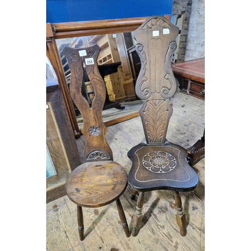 253 - Two 20th century carved hall chairs