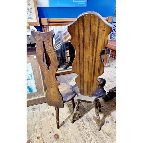 253 - Two 20th century carved hall chairs