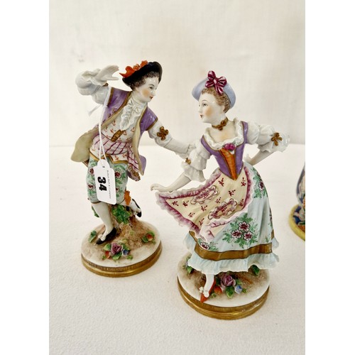 34 - Four various figurines including pair of continental dancing lady and gentleman, a bisque group and ... 
