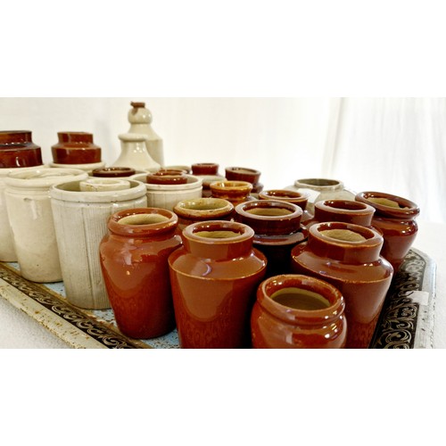 63 - Collection of stoneware jars and bottles