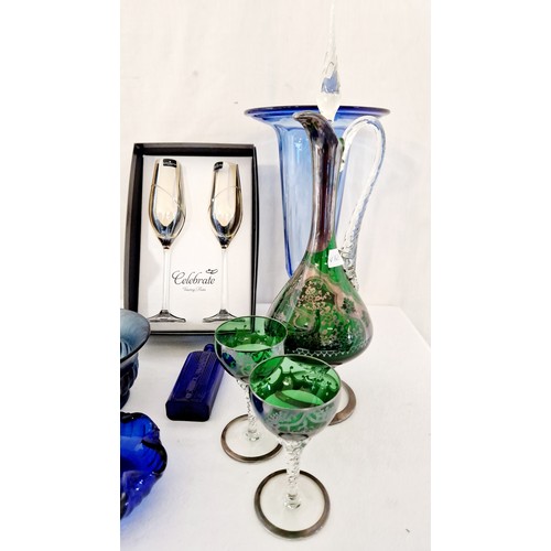 74 - Various decorative coloured glassware incl. a pair of boxed Dartington champagne flutes