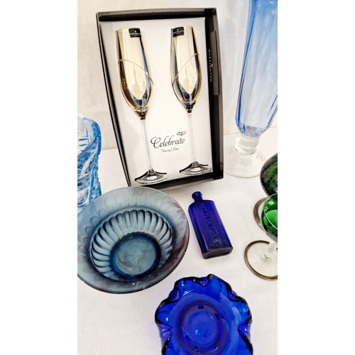 74 - Various decorative coloured glassware incl. a pair of boxed Dartington champagne flutes