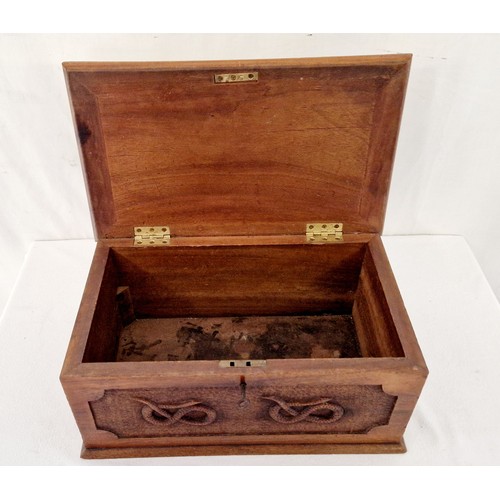 85 - Hardwood casket with relief serpentine panels and two curtain tie backs