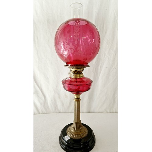 115 - Late Victorian oil lamp with cranberry glass reservoir and shade