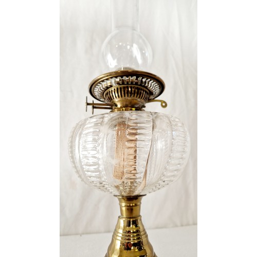 116 - Edwardian oil lamp with clear glass reservoir with brass support to glass plinth