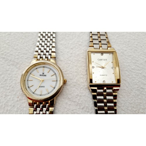 138 - Ladies copied Rolex and Cartier wristwatches