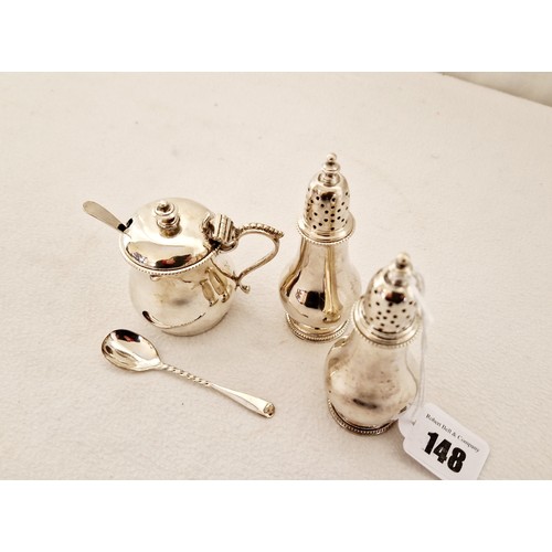 148 - A Sheffield 1903 silver three piece cruet set, comprising a pair of baluster form pepperettes, on ci... 