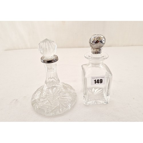 149 - Two small glass decanters, a ship’s decanter with Sheffield 1991 silver collar with swag decoration,... 