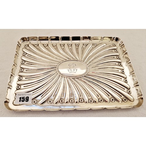 159 - A London 1902 silver rectangular dressing table tray, with embossed decoration and central cartouche... 