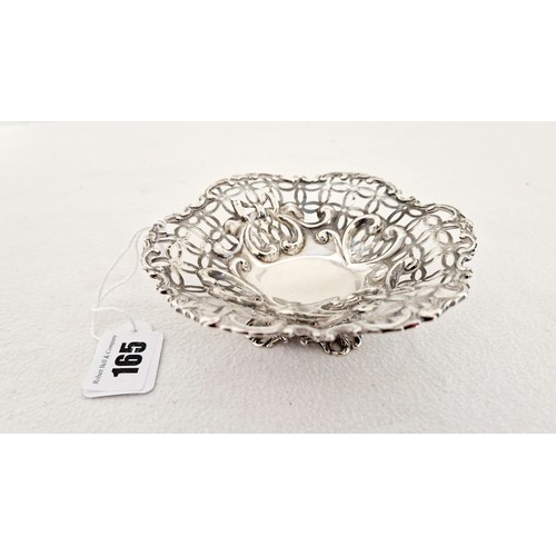 165 - A London 1892 silver bon-bon dish with profuse pierced foliate basket, heart shaped motifs and flora... 