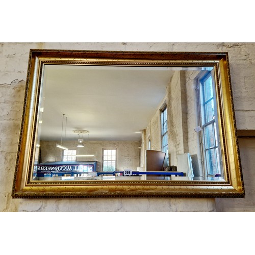 209 - Modern gilt framed rectangular wall mirror with bevelled plate