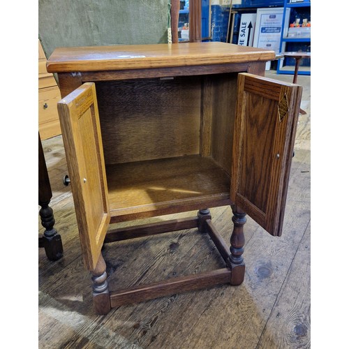 266 - Old Charm oak side cabinet with linen fold doors on turned legs