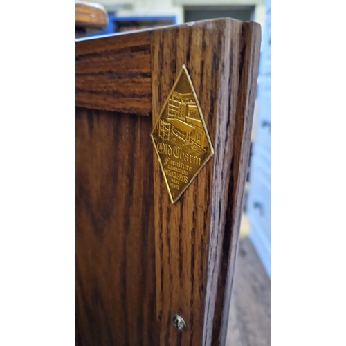 266 - Old Charm oak side cabinet with linen fold doors on turned legs